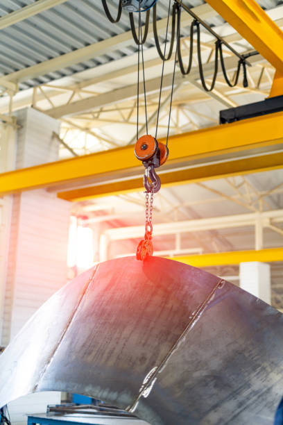 istock Industrial lifting factory tool. Hook transportation crane in warehouse. 1427687383