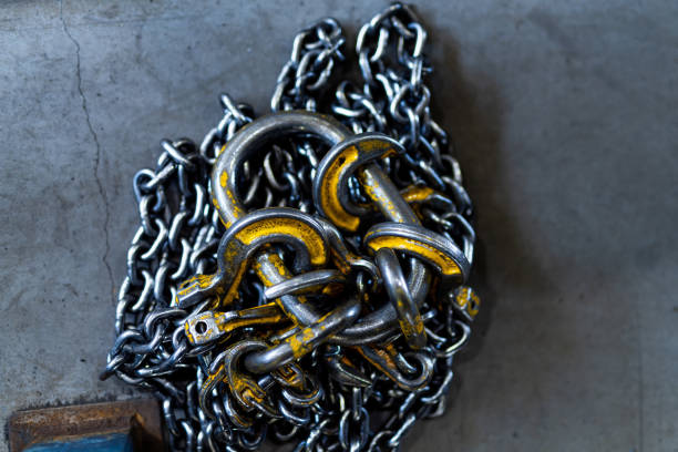 istock Factory chains for transportation. Industrial overhead crane lifts. 1427687388