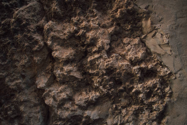 istock Brown wall texture. Stone background. Rock texture. Grunge Rough structure. Abstract texture. Rock surface with cracks. Rock pile. Paint spots. 1427691210