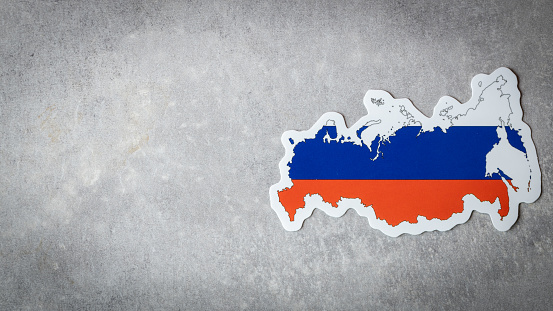 Russia flag and shape on gray background, copy space,