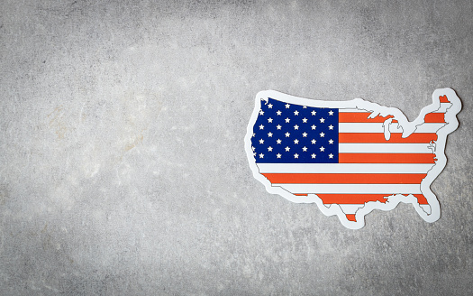 United states flag and shape on gray background, copy space,