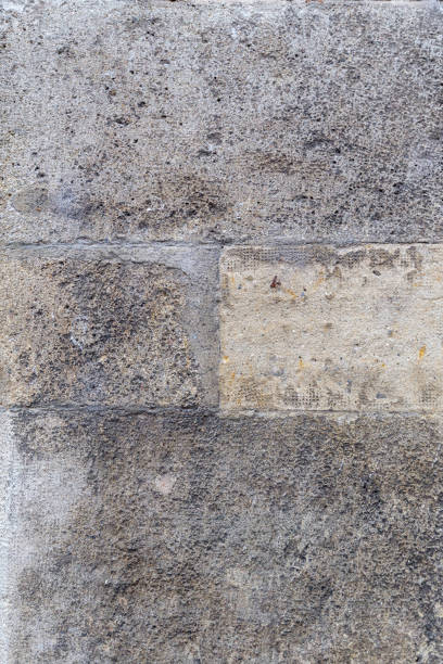 istock Background stone texture weathered wall. Symmetrical four blocks, grungy, abstract, rough texture, building bricks. 1427693487