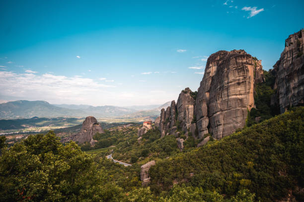 A photo of world famous  rock climbing destination, giant boulders and an open valley behind.