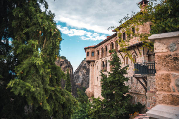 Side view of the monastery walls in world famous area of Meteora, stone and Mediterranean greens in strong contrast.