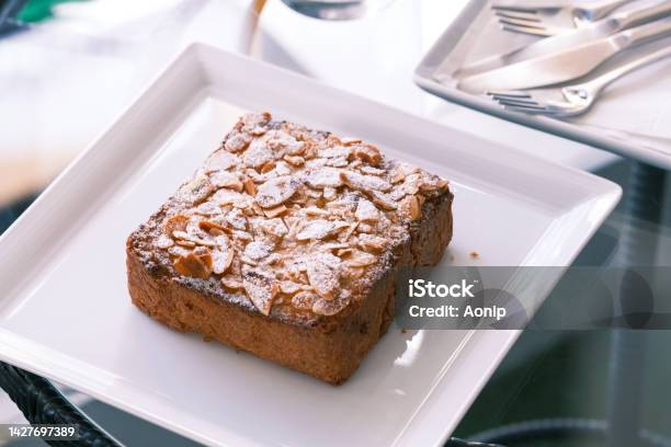 Selective Focus Bostock With The Addition Of Almond Cream Made Of Baked Brioche Slices Close Up View Traditional French Sweet Toast French Patisserie Almond Toast Stock Photo - Download Image Now