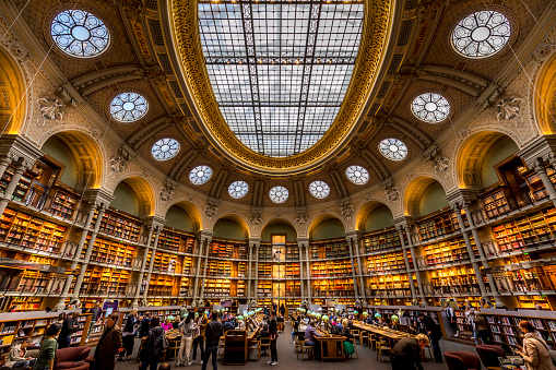People studying in the Oval Room of a Richilieu National Library in Paris, France on October 5, 2022.