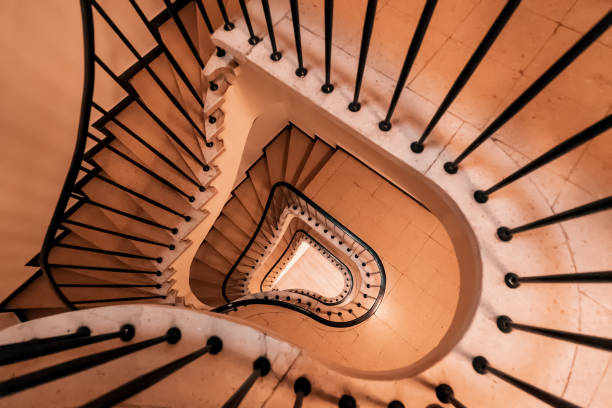istock Geometric spiral pattern extending down the architectural elements of the stairs in the house 1427702710