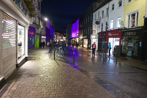 Galway, Ireland - September 6, 2022: Night view of downtown Galway, Ireland on William Street.