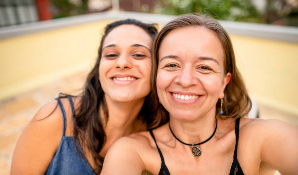 istock Smiling friends taking a selfie together outside in summer 1427706451