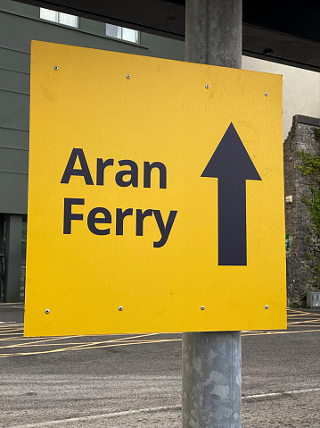 Close up of directional sign for Aran Ferry in Ireland
