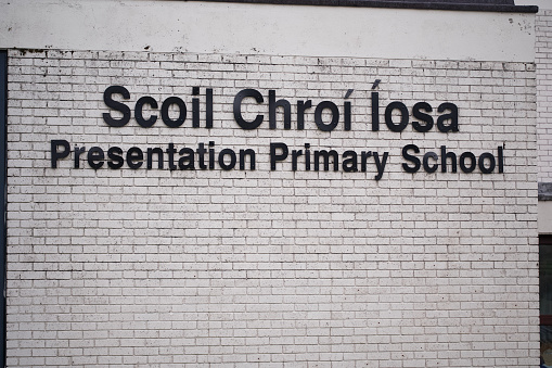 Galway, Ireland - September 8, 2022: Sign for Scoil Chroi Iosa Presentation Primary School on Newcastle Road in Galway, Ireland.