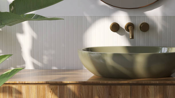 luksusowy design umywalki łazienkowej z czarnym drewnianym blatem, zieloną okrągłą ceramiczną umywalką ze światłem słonecznym z okna na białej ścianie z płytek - indoors bathroom inside of contemporary zdjęcia i obrazy z banku zdjęć