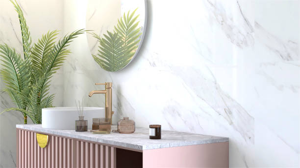 istock Modern and luxury pink bathroom vanity with marble counter top and white round ceramic washbasin in sunlight from window with vase of flower and scent sticks 1427711457