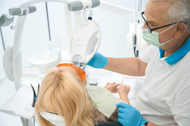 istock Dentist doing ultraviolet whitening of teeth in dentistry 1427711770