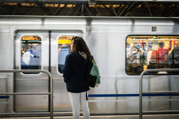 The subway arrived A young woman on the platform and the subway arriving underground stock pictures, royalty-free photos & images