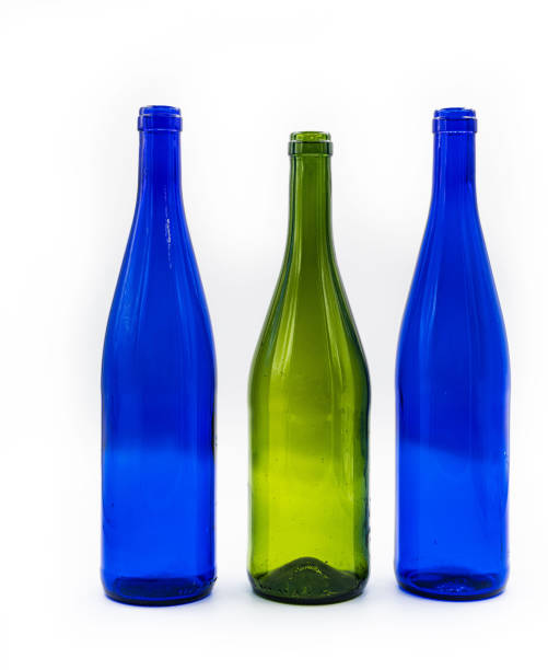 istock Three bottles of wine. dark blue and turquoise. isolated on white background. 1427713274