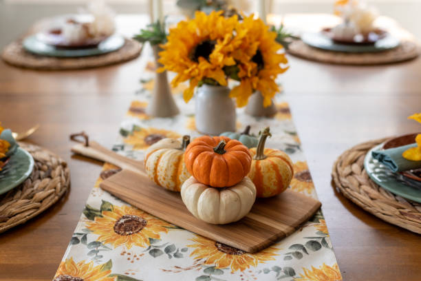 istock Beautiful fall dining table with pumpkins and sunflowers 1427714956