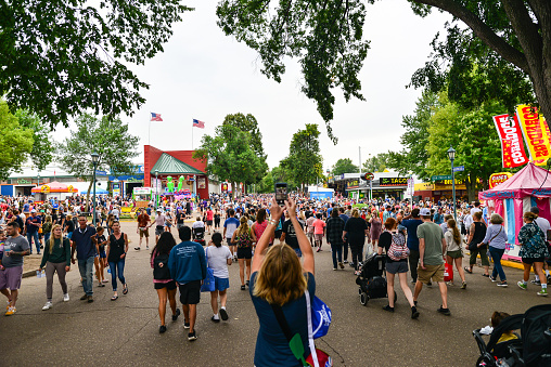 08/27/2022 - Falcon Heights, Minnesota, USA: Crowds of people walking around the fairgrounds for the Minnesota State Fair.