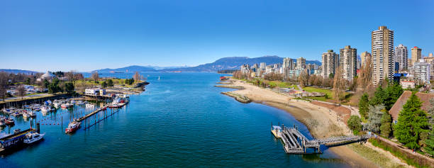 Vancouver downtown. View of the skyscrapers along False Creek and English Bay, Vancouver, BC, Canada Vancouver downtown. View of the skyscrapers along False Creek and English Bay, Vancouver, BC, Canada beach english bay vancouver skyline stock pictures, royalty-free photos & images
