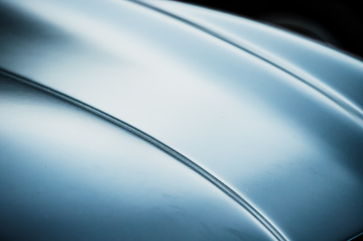 istock Abstract defocused and blurred photo of a luxury car hood 1427716683