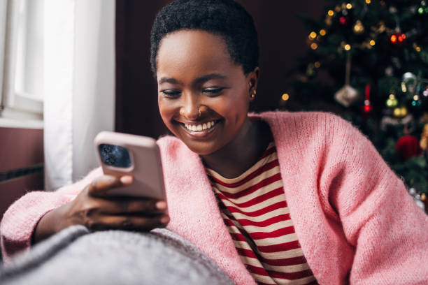 istock Woman Browsing Social Media On Her Cell Phone Device 1427719904