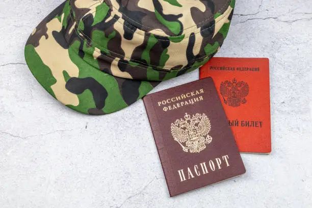 Photo of The concept of mobilization. Text in Russian PASSPORT OF THE RUSSIAN FEDERATION and MILITARY ID