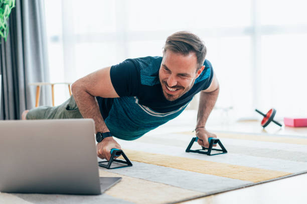 istock Young man exercising at home 1427734572