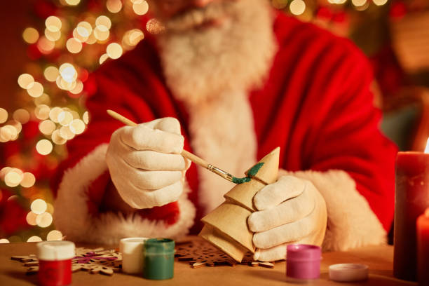 istock Santa Claus Making Toys 1427747954