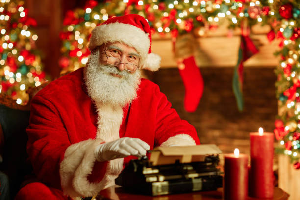 istock Santa Claus Typing Letter 1427748474