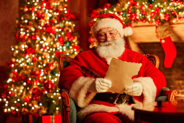 istock Santa Reading Letter On Christmas 1427748512