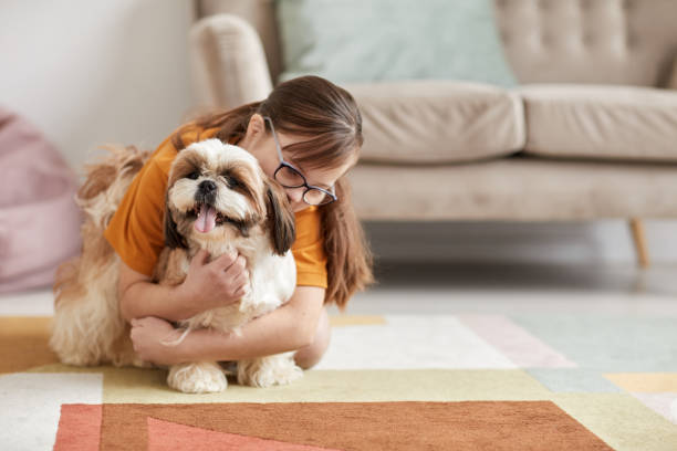 istock Girl Playing With Dog 1427749769