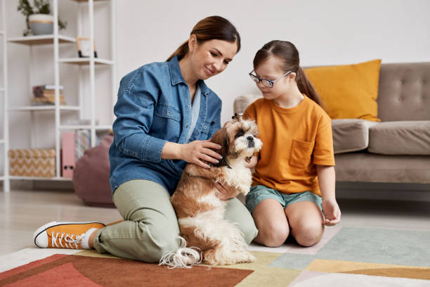 istock Special Family Playing With Dog 1427749774