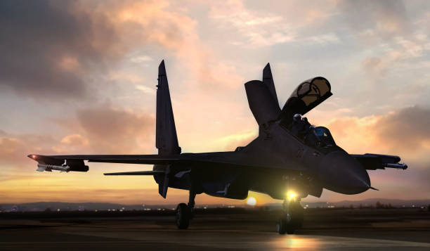istock Fighter jet on air force base airfield getting ready to take off at sunset 1427757059