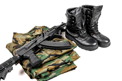 Military uniform and Kalashnikov assault rifle