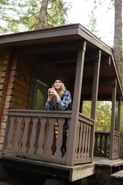 istock Woman at a Cabin on Vacation in Oregon 1427796737