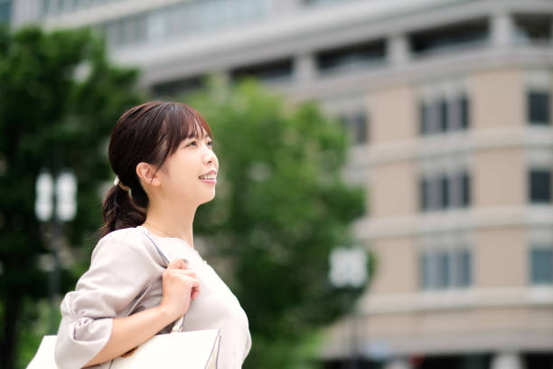 istock Confident businesswoman and office building 1427797431