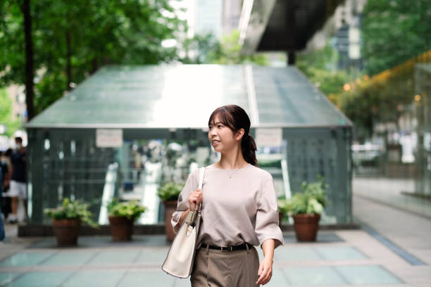 istock Woman walking in commercial district 1427797481