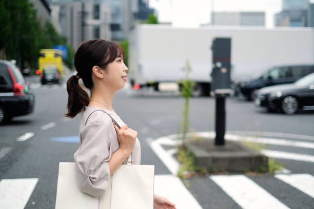 istock Woman walking on street 1427797494