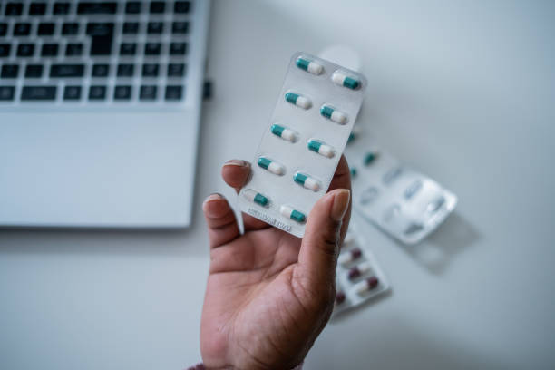 istock Hand holding medicine 1427813783