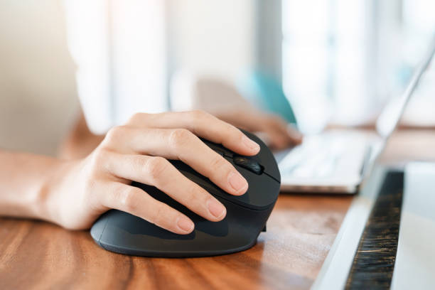 istock woman hand using computer ergonomic mouse, prevention wrist pain because working long time. De Quervain s tenosynovitis, Intersection Symptom, Carpal Tunnel Syndrome or Office syndrome concept 1427828167