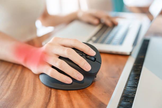 istock woman hand using computer ergonomic mouse, prevention wrist pain because working long time. De Quervain s tenosynovitis, Intersection Symptom, Carpal Tunnel Syndrome or Office syndrome concept 1427828169