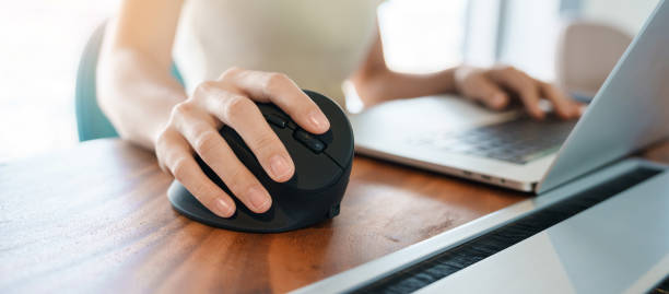 istock woman hand using computer ergonomic mouse, prevention wrist pain because working long time. De Quervain s tenosynovitis, Intersection Symptom, Carpal Tunnel Syndrome or Office syndrome concept 1427828170
