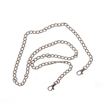 Metal chain for the bag on a white background. Close-up of haberdashery and costume jewelry.