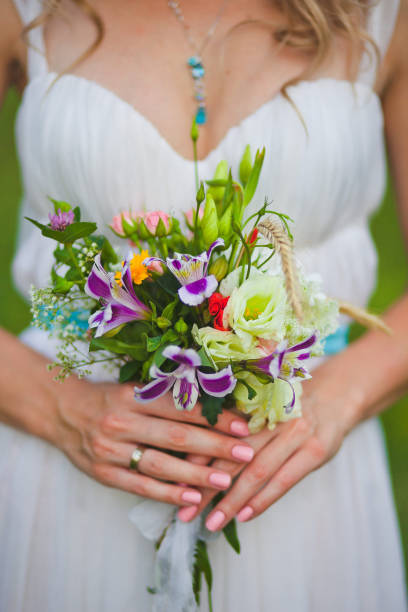 istock Bright wedding bouquet in hands of the bride 1427840202