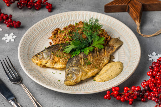 istock Grilled fish with mashed potatoes and spinach with Prepared mackerel fish, vegetables and basil 1427844526