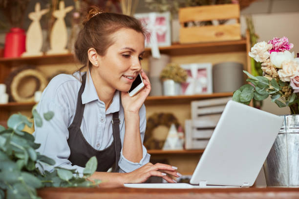 istock Self employed florist working at flower shop 1427845741