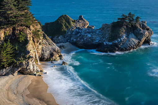 McWay Falls is an 80-foot-tall (24 m) waterfall on the coast of Big Sur in central California that flows year-round from McWay Creek in Julia Pfeiffer Burns State Park, about 37 miles (60 km) south of Carmel, into the Pacific Ocean. During high tide, it is a tidefall, a waterfall that empties directly into the ocean. The only other tidefall in California is Alamere Falls.