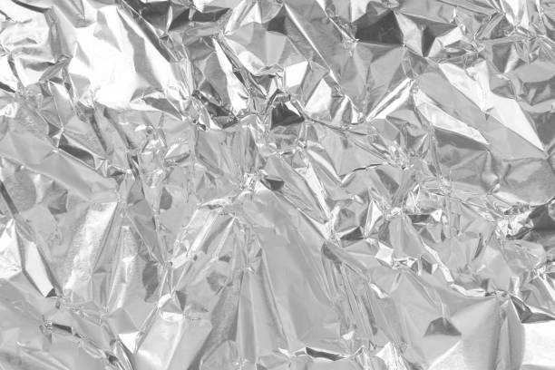 istock Silver foil leaf shiny texture, abstract grey wrapping paper for background and design art work. 1427847685