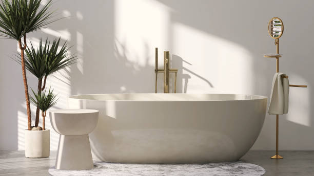istock Beige ceramic side table by bathtub in luxury design bathroom and tropical tree with sunlight from window and leaf shadow on white wall 1427848452