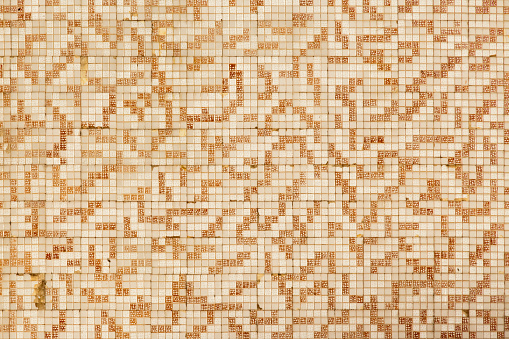 Brown and white old-fashioned small tiles pattern background. Gresite. Full frame view suitable for background purposes. Fishing village tradition ,Arousa island, Pontevedra province, Galicia, Spain. Antiquities.